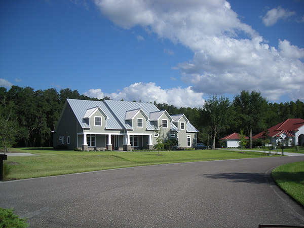 a large family home with a new metal roof