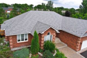 a large family home with new asphalt shingle roof